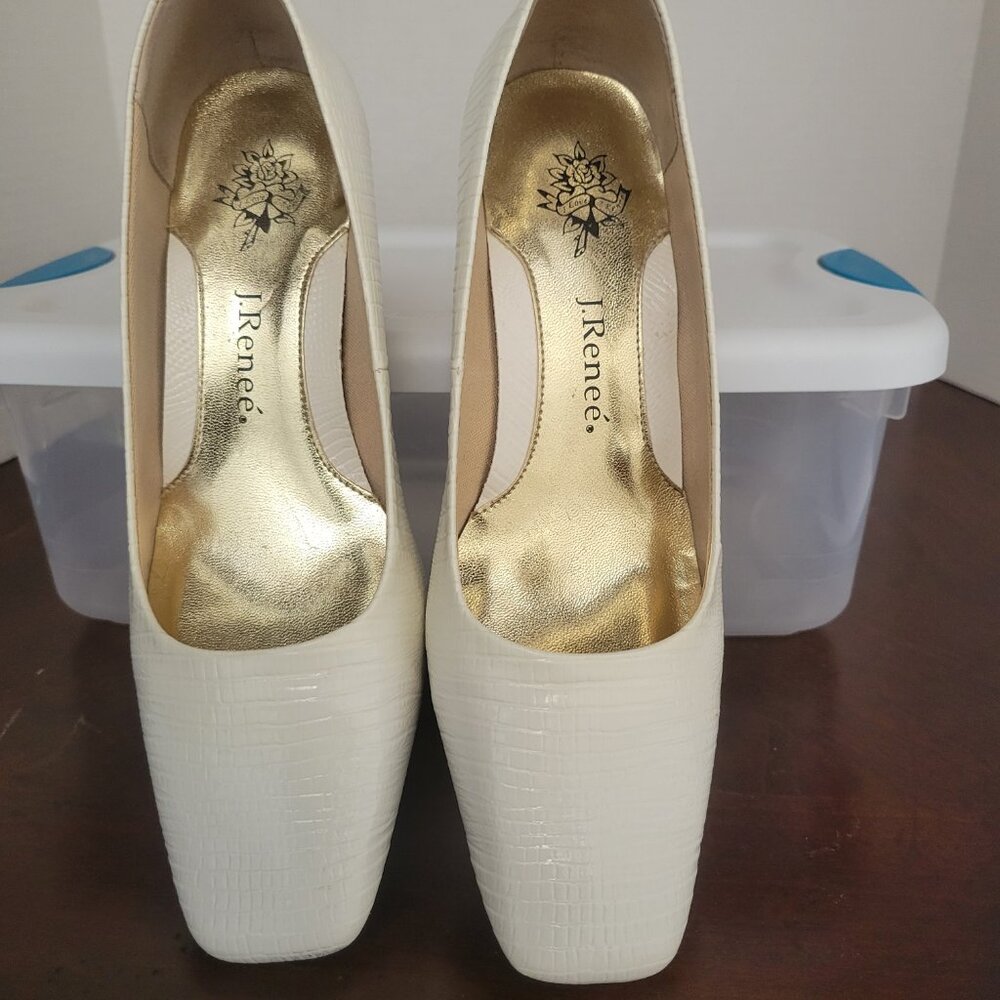 White square-toed lizard pumps.